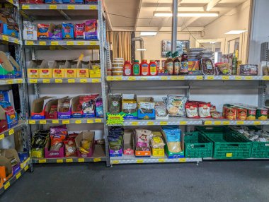 France, 12 August 2024 : Grocery store shelves stocked with various spices and sauces clipart