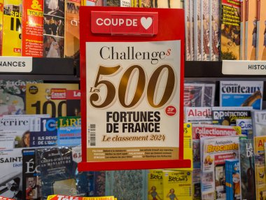 France, 31 August 2024: Display of Challenges magazine featuring the 500 richest fortunes of France ranking 2024