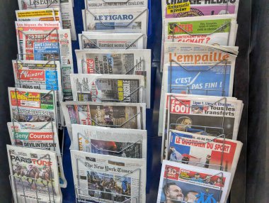 France, 30 September 2024 : Newspapers in a Stand Featuring Diverse Headlines and Publications clipart