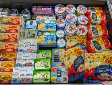 France, 5 September 2024: Dairy products on supermarket shelf including cheese and butter clipart