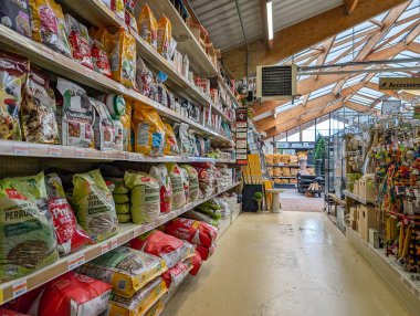 France, 28 October 2024 : Pet food aisle in a brightly lit store environment clipart