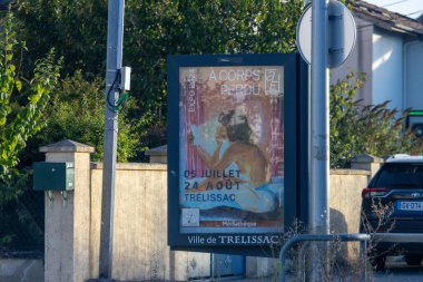 France, 10 August 2024 : Art exhibition poster in Trelissac featuring a seated figure. clipart