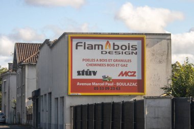 France, 16 August 2024: Advertising billboard for Flambois Design on the side of a building clipart