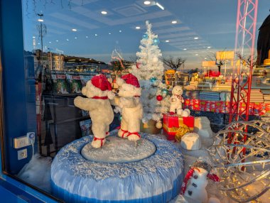 France, 04 December 2024 : Festive window display featuring polar bears and Christmas decorations clipart