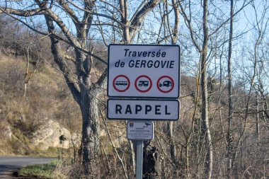 France, 01 January 2025 : Road sign warning, restricted vehicles, Gergovie, trees, clear sky clipart