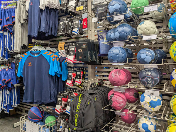 France, 02 January 2025 : Sports apparel and equipment display in vibrant retail store setting