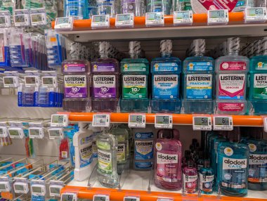 France, 25 January 2025 : Various Brands of Mouthwash on a Store Shelf Display clipart