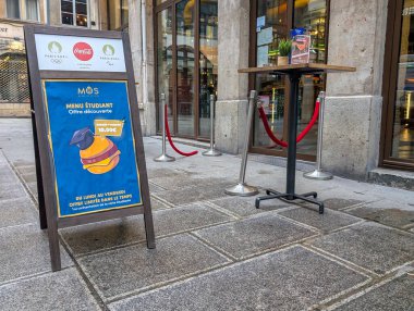 France, Lyon 04 February 2025 : Restaurant entrance with a student menu offer sidewalk sign clipart