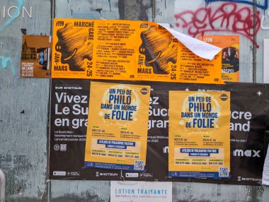 France, Lyon 04 February 2025 : Colorful Posters Display Upcoming Events and Concerts on Wall clipart