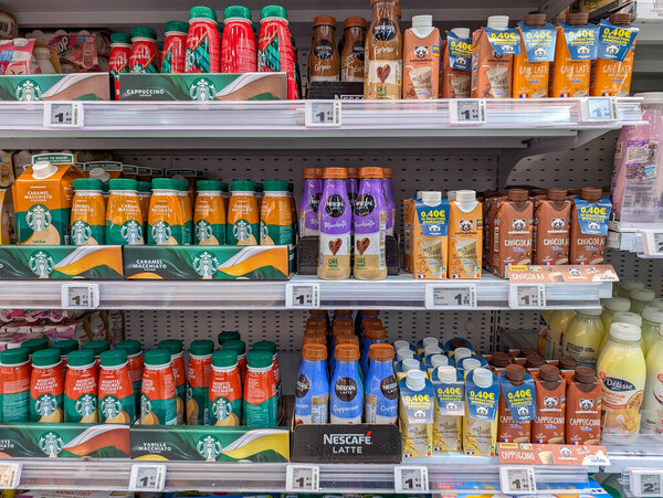France, 17 January 2025 : Various coffee drinks displayed on supermarket shelf in colorful packaging