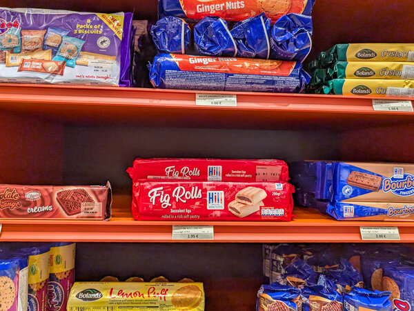 France, 17 December 2024 : Biscuit Shelf Display Featuring Fig Rolls and Ginger Nuts
