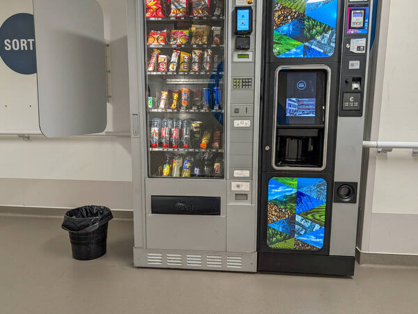 France, 05 March 2025 : Vending machine, snacks, beverages, recycling bin, hallway, modern technology, convenience.