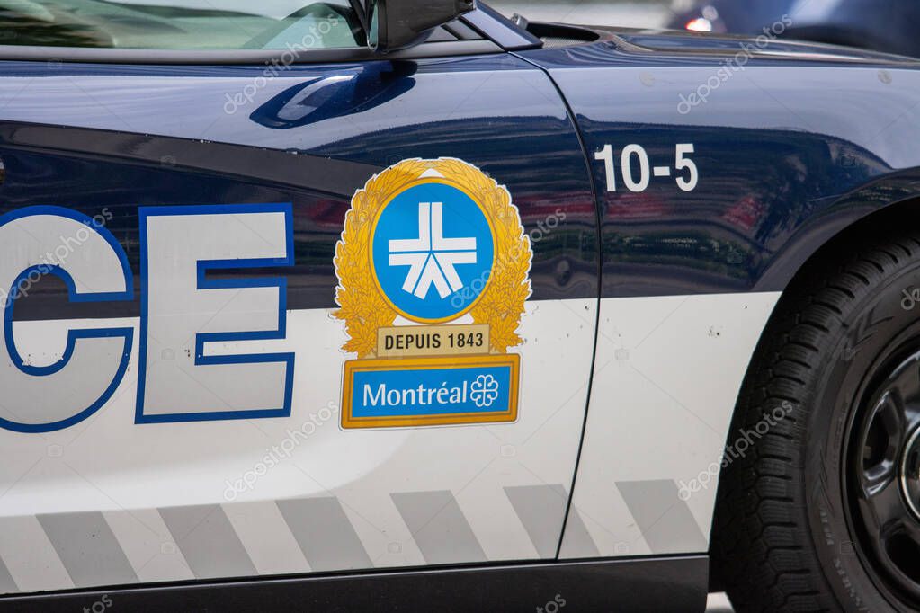 Canada, 05 July 2025 : Montreal police car door emblem badge blue white details