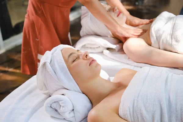 caucasian white woman relaxing in spa massage