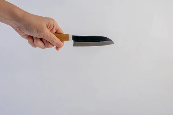 stock image Hand and utility knife isolated on white background.