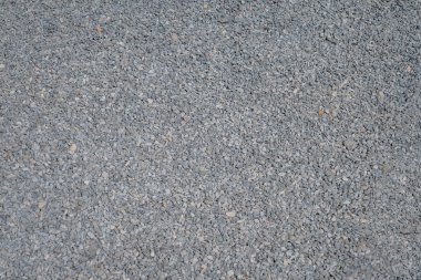 White crushed stones texture background. Gray rubble construction rock pebble pattern. 