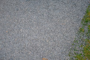 White crushed stones texture background. Gray rubble construction rock pebble pattern. 