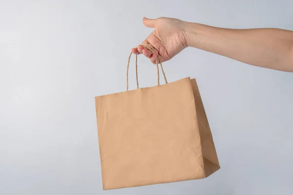 Hand Holding Paper Bag Isolated White Background — Stock Photo, Image