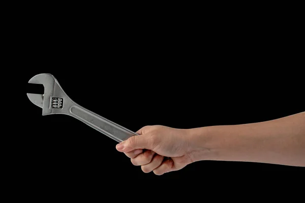 Ein Schraubenschlüssel Der Hand Isoliert Auf Schwarzem Hintergrund — Stockfoto