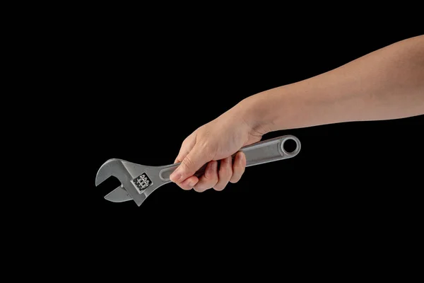 Ein Schraubenschlüssel Der Hand Isoliert Auf Schwarzem Hintergrund — Stockfoto