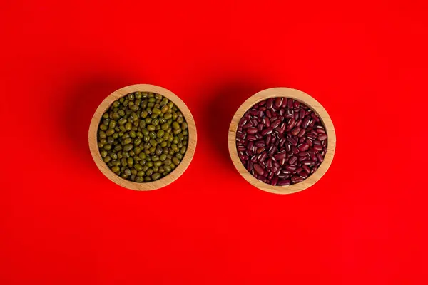 Mung beans and Red kidney beans in a basket wooden on red background