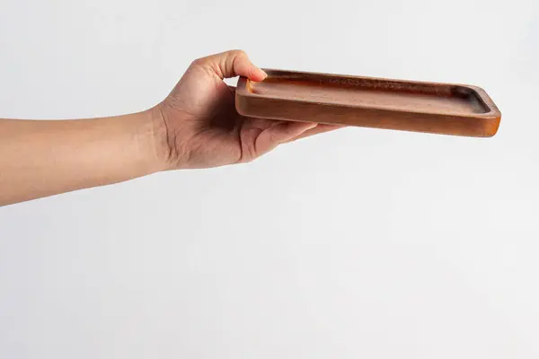 Beyaz zemin üzerinde ahşap plaka.