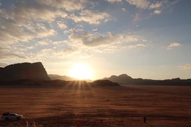Tourists watching the sunset in the Wadi Rum desert, Jordan 2021