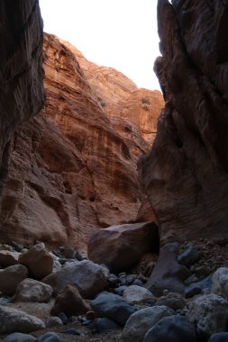 Colorful stones and rocks in the deep Wadi Ghuweir Canyon, Dana, Jordan 2021