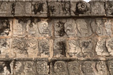 Skull pattern on the Tzompantli, skull platform, plataforma de los craneos, at Chichen Itza, close to Valladolid, Mexico 2022 clipart