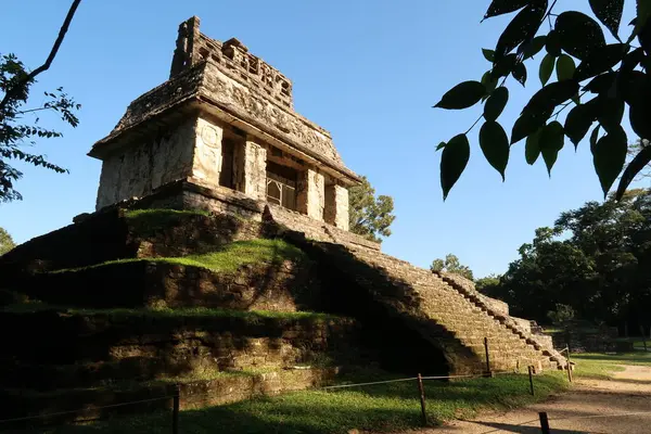 First sun light on the Temple of the Sun/Templo del Sol in the early morning at Palenque archaeological site, Mexico 2022