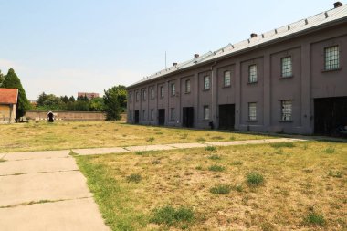 Inside the courtyard, yard of the Red Cross, Crveni Krst Concentration Camp, the main building can be seen on the right, Nis, Serbia 2022 clipart