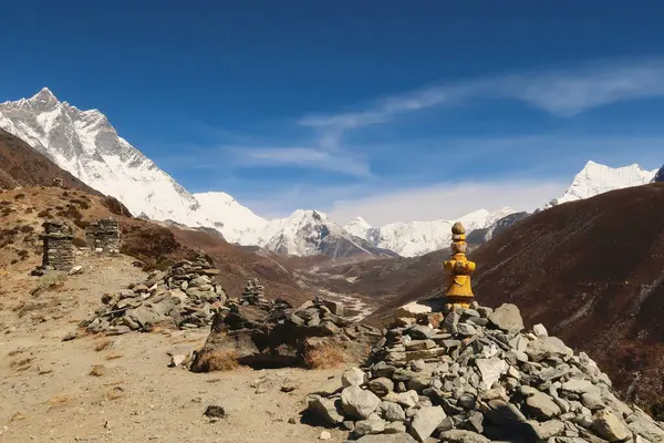 stock image Stacks, piles of stones, rocks on the way to the Dingboche view point, Mount Lhotse and Island peak can be seen in the background, Mount Everest Base Camp Trek, EBC, Nepal 2022