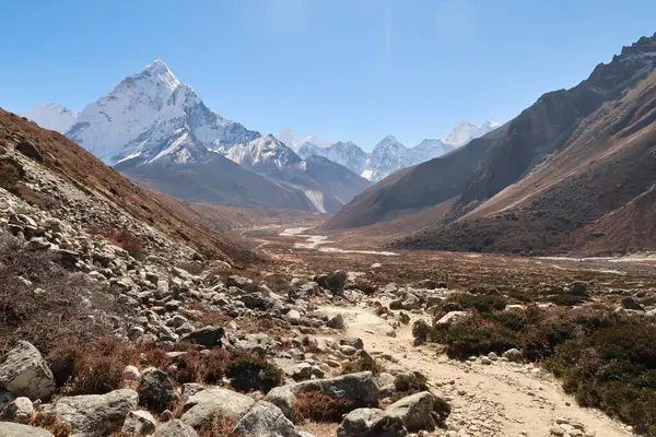 stock image View into the Pheriche valley, Pheriche village can be seen in the distance in front of Mount Amphu Gyabjen, Ama Dablam, Kangtega and Thamserku, Mount Everest Base Camp Trek, EBC, Nepal 2022