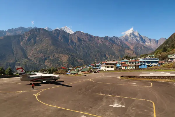 Stock image The airfield, landing field of the Hillary-Tenzing Airport, Lukla Airport, a small plane, aircraft is waiting for take off, Kongde Ri peak in the background, Mount Everest Base Camp Trek, EBC, Nepal 2022