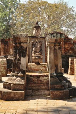 Small sitting buddha statue at the Wat Si Chum Temple, Historical Park, archaeological site, ancient ruins of Sukhothai, Thailand 2023 clipart