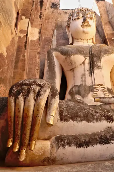 stock image The big golden hand of the Phra Achana, a majestic sitting buddha statue inside the Wat Si Chum Temple, Historical Park, archaeological site, ancient ruins of Sukhothai, Thailand 2023