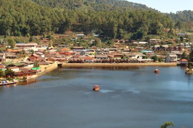 View onto the lake in the Ban Rak Thai, Mae Aw Village, a chinese village in northern Thailand, close to the border to Myanmar, Mae Hong Son Loop, Thailand 2023 clipart