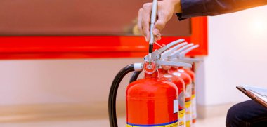 Male Professional inspection Fire extinguisher,safety concept.