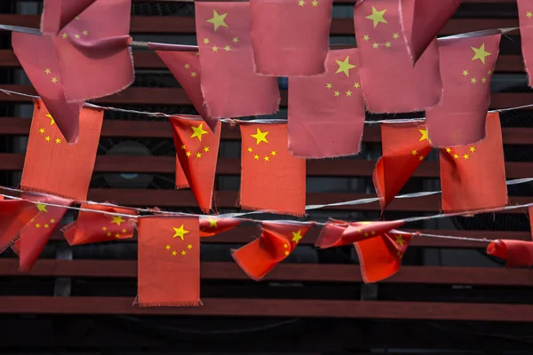 soft focus of row of Chinese flag.