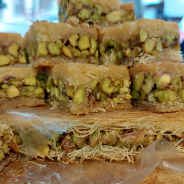 a vertical shot of a delicious and fresh arabic sweets