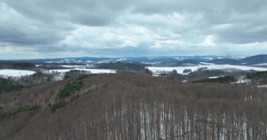 Forest mountain beech snow Bile Karpaty UNESCO snowfall biosphere reservation White Carpathians Czech meadows drone aerial hill snowy frost winter Bile Karpaty wood video shot forest virgin of Fagus