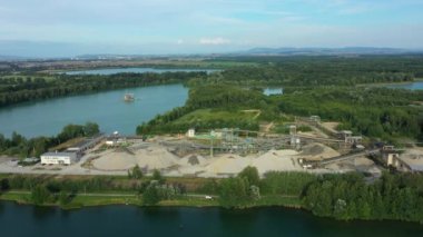 Mining for gravel sand factory open pit drone aerial Tovacov excavator crane bucket transport by car track trailer and rail or digger machine dredger extraction colliery output of building surface