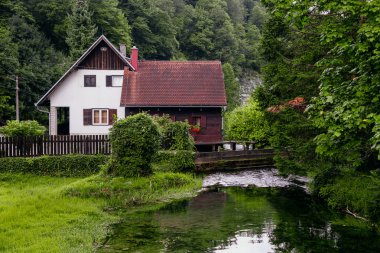 Beautiful waterfall at famous Rastoke village in Slunj, Coratia. clipart