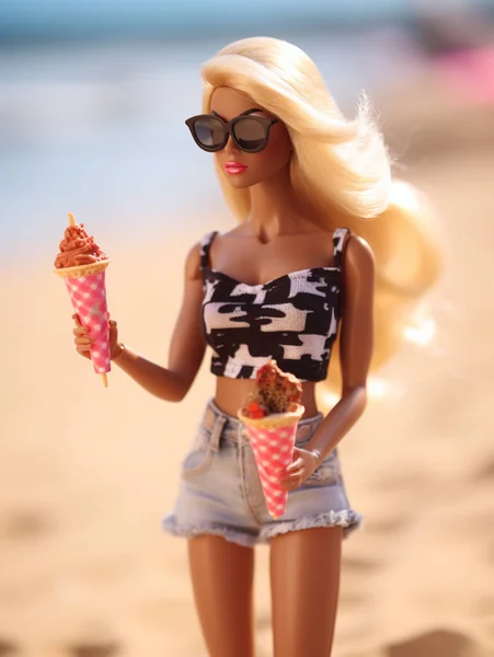 stock image Barbie doll in trendy summer outfit on the beach with ice cream.