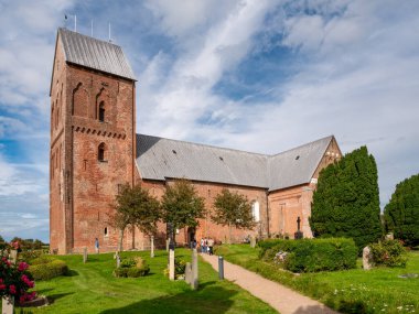 Foehr, Germany - Aug 29, 2023: Saint John's Church with churchyard in Nieblum on Foehr island, North Frisia, Schleswig-Holstein clipart