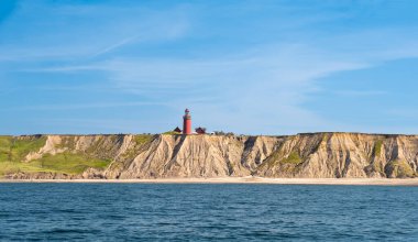 Bovbjerg lighthouse and cliffs from North Sea, Ferring, Lemvig, Central Jutland, Denmark clipart