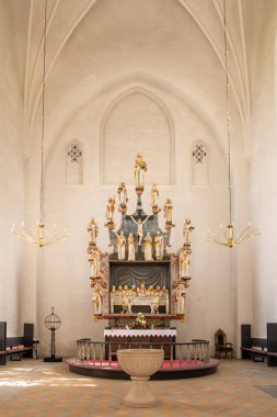 Mariager, Denmark - Sep 20, 2023: Interior view of Mariager Church, featuring choir with altar and altarpiece, Nordjylland, Denmark clipart