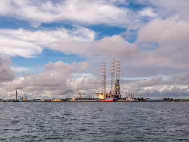 Grenaa, Denmark - Sep 22, 2023: Drilling rig in harbour of Grenaa, Djursland, Midtjylland clipart