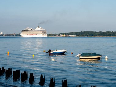 Kiel Fjord - Jul 19, 2024: Ferryboat sailing across the Kiel Fjord near Holtenau, Schleswig-Holstein clipart