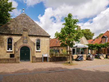 Ameland, Netherlands - Jun 28, 2024: Amelander Cultuur Museum in former church on Kerkplein in center of Nes on West Frisian island Ameland, Friesland clipart